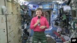FILE - NASA, astronaut Peggy Whitson speaks during an interview aboard the International Space Station.