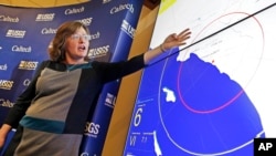 FILE - In this Jan. 28, 2014 file photo, Dr. Lucy Jones, senior advisor with the U.S. Geological Survey, describes how an early warning system would provide advance warning of an earthquake, at the California Institute of Technology in Pasadena. (AP Photo/Reed Saxon,File)