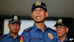 Philippine National Police Director General Ricardo Marquez reads the joint statement of the military and police on the beheading of Canadian hostage John Ridsdel of Calgary, Alberta by Muslim extremist Abu Sayyaf group in southern Philippines Tuesday, April 26, 2016 at Camp Crame in suburban Quezon city, northeast of Manila, Philippines.
