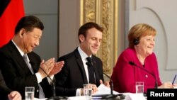中国国家主席习近平、法国总统马克龙、德国总理默克尔在法国巴黎爱丽舍总统府举行新闻发布会(2019年3月26日)