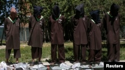 FILE - Insurgents suspected of being from the Haqqani network are presented to the media at the National Directorate of Security (NDS) headquarters in Kabul, Afghanistan, May 30, 2013. Afghan President Ashraf Ghani and U.S. officials allege Haqqanis operate out of sanctuaries in Pakistan, a charge Islamabad rejects.