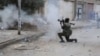FILE - A Libyan military soldier fires his weapon during clashes with Islamic extremist militias in Benghazi, Libya, Oct. 30, 2014. 