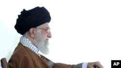 FILE - In this picture released by official website of the office of the Iranian supreme leader, May 10, 2017, Supreme Leader Ayatollah Ali Khamenei attends a graduation ceremony for Revolutionary Guard cadets in Tehran.