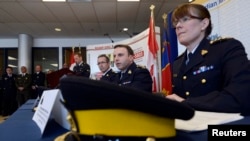 RCMP Chief Superintendent Jennifer Strachan (R), Assistant Commissioner James Malizia (C) and Chief Superintendent Gaeten Courchesne (L) speak during a news conference in Toronto, Ontario, April 22, 2013.