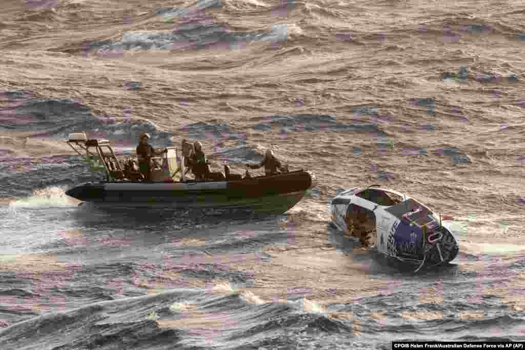Navy sailors from HMAS Choules use an inflatable boat to rescue Lithuanian rower Aurimas Mockus, Monday, March 3, 2025