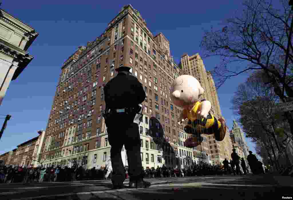 The Charlie Brown balloon floats down Central Park West during the 86th Macy's Thanksgiving Day Parade in New York, November 22, 2012.