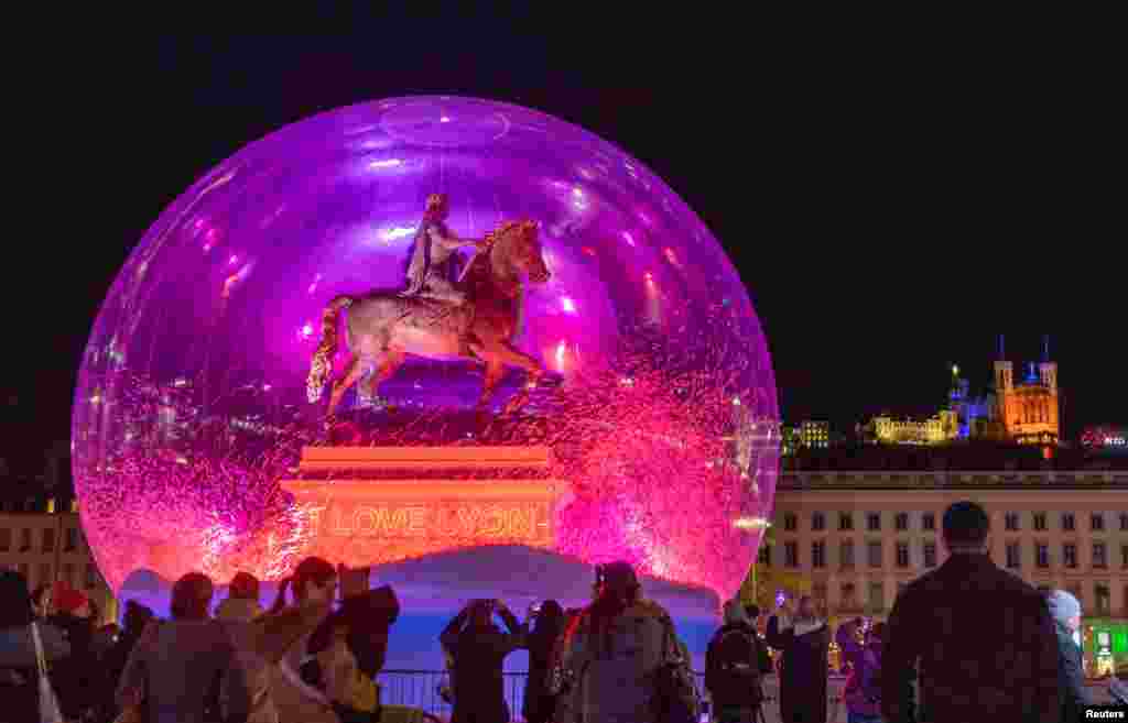 The art installation "I Love Lyon" by Jacques Rival is seen during the festival of lights (Fetes des Lumieres) in Lyon, France, Dec. 4, 2024.