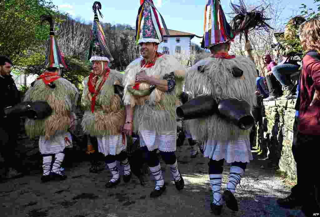 "Joaldunak" (bellringers in Basque language) march with big cowbells hanging on their backs during the traditional carnival of Ituren, in the northern Spanish province of Navarre, Spain.