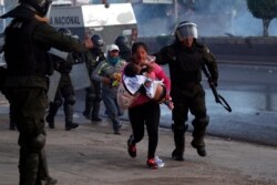 Police detain backers of former President Evo Morales on the outskirts of Cochabamba, Bolivia, Nov. 16, 2019.