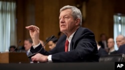 Retiring Montana Sen. Max Baucus testifies on Capitol Hill in Washington, Jan. 28, 2014, before the Senate Foreign Relations Committee hearing on his nomination to become U.S. ambassador to China.