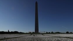 People visit Suzanne Brennan Firstenberg's "In America: Remember", a memorial for Americans who died due to the coronavirus disease (COVID-19).