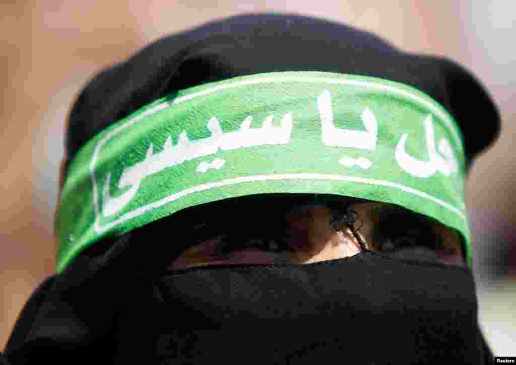 A member of the Muslim Brotherhood at a rally around Rabaa Adawiya square, Cairo, July 26, 2013.