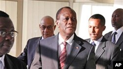 Alassane Ouattara arrives for a meeting on Ivory Coast at the African Union Commission headquarters in Addis Ababa, Thursday March 10, 2011