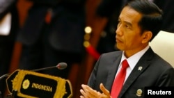 FILE - Indonesia's President Joko Widodo, shown at an ASEAN summit meeting last year in Naypyitaw, Myanmar, will be accompanied on his U.S. visit by tech leaders, who will be part of meetings with Microsoft, Facebook and Apple executives.