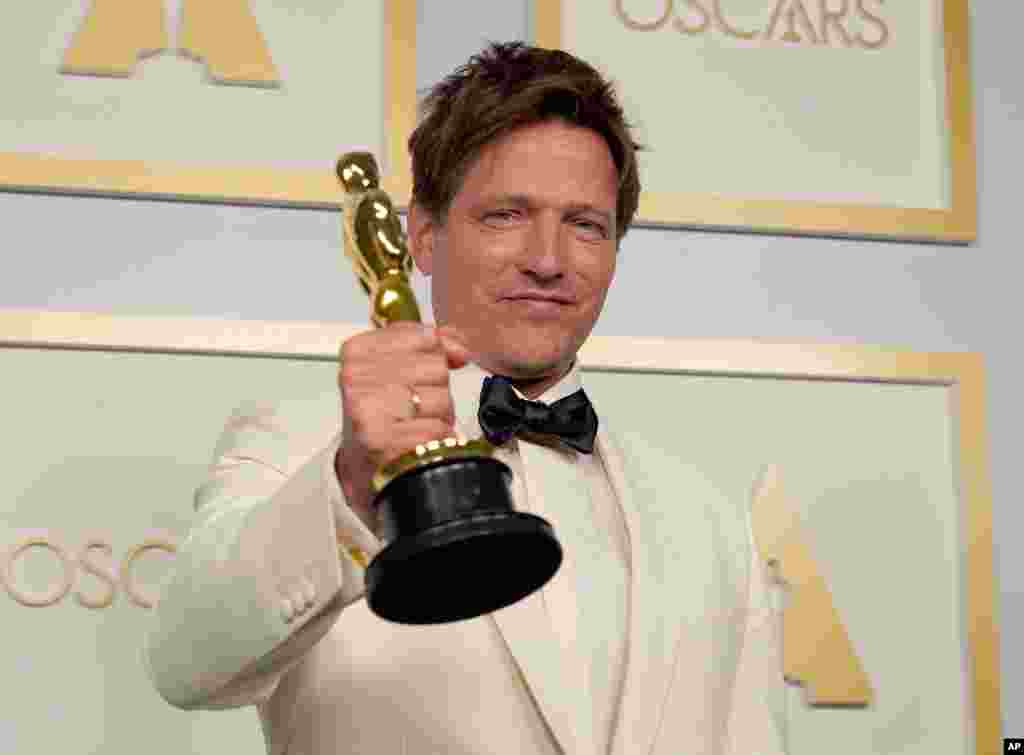 Thomas Vinterberg, from Denmark poses with the award for best international feature film for "Another Round" in the press room at the Oscars on Sunday, April 25, 2021, at Union Station in Los Angeles. (AP Photo/Chris Pizzello, Pool)