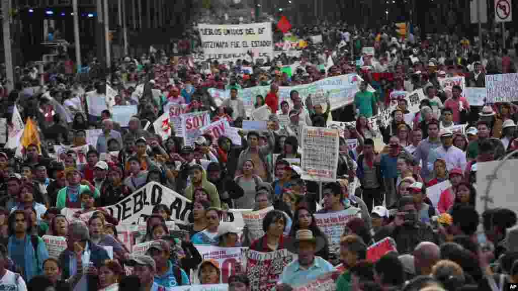 Tens of thousands of demonstrators march in protest for the disappearance of 43 students in the state of Guerrero, in Mexico City, Nov. 5, 2014.