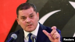 FILE - Libya's new Prime Minister Abdulhamid Dbeibeh speaks during a news conference in Tripoli, Libya, Feb. 25, 2021.