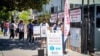 People stand in line to get a COVID-19 vaccine outside Kheir Center, nonprofit health care and human service agency in the Koreatown neighborhood of Los Angeles.CA.