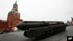 FILE - Russian Topol M intercontinental ballistic missile launcher rolls along Red Square during the Victory Day military parade to celebrate 72 years since the end of WWII and the defeat of Nazi Germany, in Moscow, Russia, May 9, 2017. With a deadline of Feb. 5, 2018 to verify compliance, Russia says it has met the nuclear arsenal limits of a key arms control treaty, but has some issues with U.S. compliance.