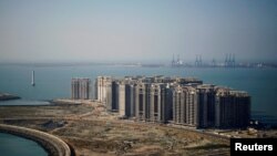 FILE PHOTO: An aerial view shows the 39 buildings developed by China Evergrande Group that authorities have issued demolition order, on the man-made Ocean Flower Island in Danzhou, Hainan province, China January 6, 2022. (REUTERS/Aly Song/File Photo/File Photo)