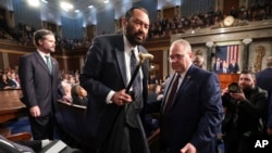 Rep. Al Green, a Democrat from Texas, is removed from the chamber as President Donald Trump addresses a joint session of Congress at the Capitol in Washington, March 4, 2025. 