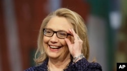 Secretary of State Hillary Rodham Clinton adjusts her glasses during a Global Townterview at the Newseum in Washington, January 29, 2013.