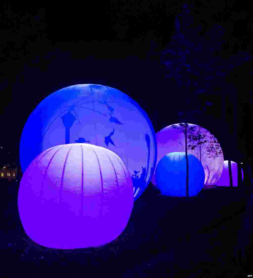 Spheres are iluminated with lights in an instalation in the framework of the Mexican International Festival of Lights in Mexico city, Mexico, Nov. 07, 2013.