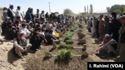 The victims of a deadly mosque attack, Aug. 3, 2018, in Gardez, the capital of Paktia province, eastern Afghanistan, were buried in a common grave Saturday under tight security.