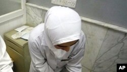 A wounded Iraqi woman receives medical care at a hospital in the northern Iraqi city of Mosul, after a double bomb attack targeting buses carrying Christian students and university workers near Mosul in killed a shopkeeper and wounded 80 other people, 02