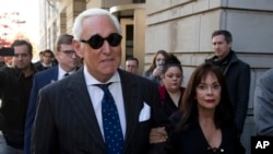 FILE - Roger Stone, left, with his wife Nydia Stone, leaves federal court in Washington, Nov. 15, 2019.