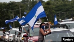 An anti-government protester takes part in a caravan of car and motorcycles to demand an end to violence in Ticuantepe, Nicaragua, July 15, 2018.