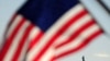 A US flag flutters above the Statue of Liberty in New York, which has become an iconic symbol of freedom and of the United States, (File)