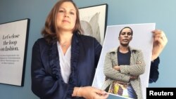 H&M Foundation Global Manager Diana Amini poses with portraits of women on its Foundation 500 list of female entrepreneurs in emerging markets in Stockholm, Sweden, June 2, 2017.