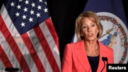 FILE - Education Secretary Betsy DeVos speaks about Title IX enforcement, which in college covers sexual harassment, rape and assault, at George Mason University, in Arlington, Virginia, Sept. 7, 2017. 