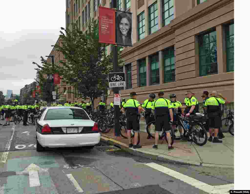 Boston Police and police from nearby districts, on bicycle patrol, getting final direction on the day's protests. City leaders have warned of zero tolerance for violence.