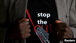 FILE - A man's T-shirt bears an anti-FGM logo in Imbirikani, Kenya, April 21, 2016. 
