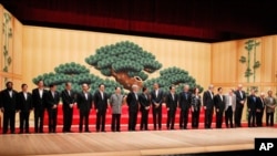 APEC leaders take part in a group photo at the APEC summit in Yokohama, Saturday, Nov. 13, 2010.