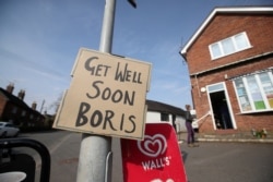 A sign of support for British Prime Minister Boris Johnson, who has been in hospital since Monday, as the spread of the coronavirus disease (COVID-19) continues, in Swynnerton, Britain, April 9, 2020.