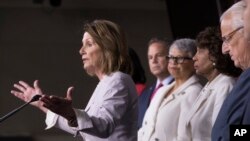 FILE - House Minority Leader Nancy Pelosi and House Democrats (L-R) David Cicilline, Rep. Bonnie Watson Coleman, Rep. Maxine Waters, and Rep. Bill Pascrell, speaks during a news conference on Capitol Hill in Washington, July 14, 2017, renewing a call for an independent commission to probe Russia's election meddling and ties to the Trump administration.