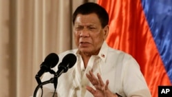 FILE - Philippine President Rodrigo Duterte gestures during the 19th Founding Anniversary of the Volunteers Against Crime and Corruption at the Malacanang Presidential Palace in Manila, Philippines, Aug. 16, 2017.