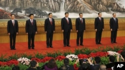 New members of the Politburo Standing Committee, from left, Zhang Gaoli, Liu Yunshan, Zhang Dejiang, Xi Jinping, Li Keqiang, Yu Zhengsheng and Wang Qishan stand in Beijing's Great Hall of the People, November 15, 2012.