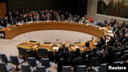 FILE - Members of the U.N. Security Council vote on a U.S. draft resolution calling for free and fair presidential elections in Venezuela at U.N. headquarters in New York, Feb. 28, 2019. 