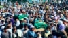 Afghans carry the body of civilians killed during fighting between the Taliban and Security forces, during their funeral in Badakhshan province, northern Afghanistan, July 4, 2021.