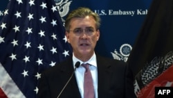 FILE - Richard Olson, who was then the U.S. special representative for Afghanistan and Pakistan, speaks during a press conference at the U.S. Embassy in Kabul, Dec. 6, 2015.