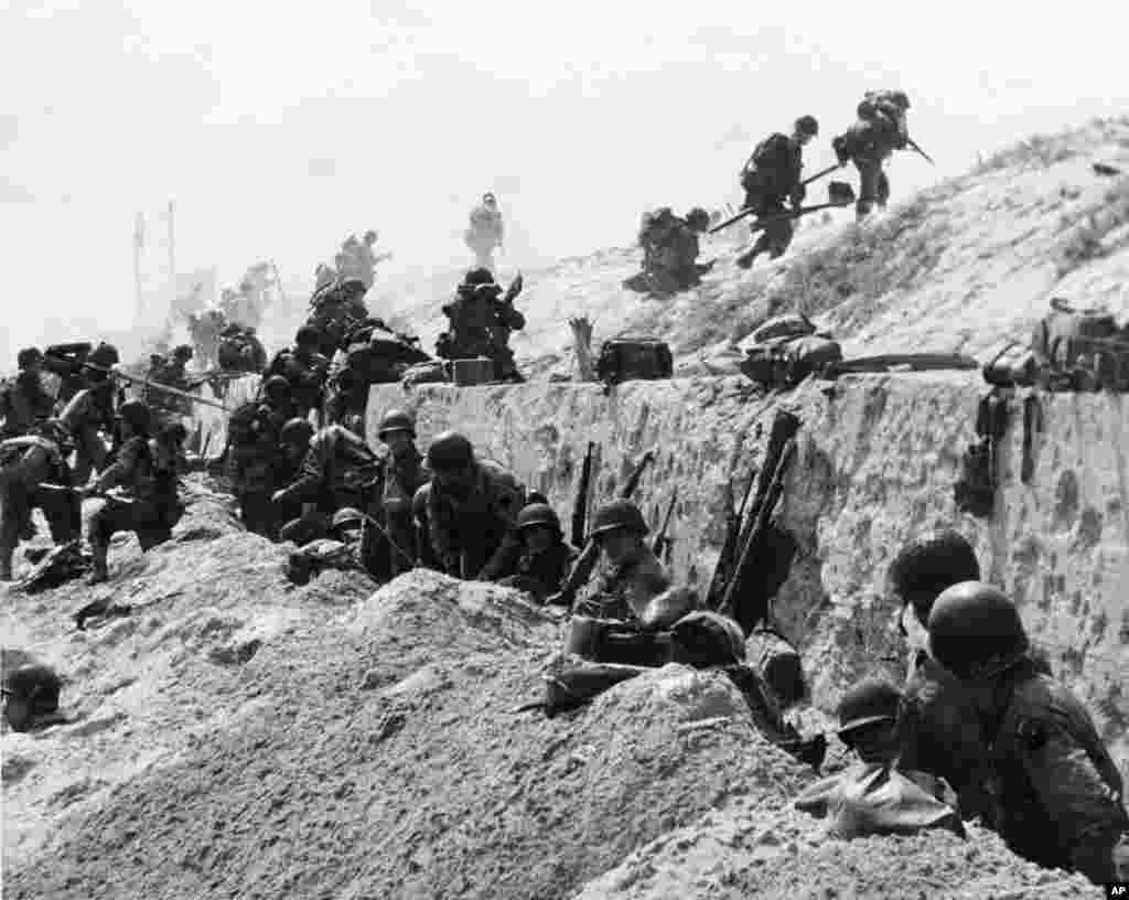 American troops move to the interior of northern France, June 6, 1944. 