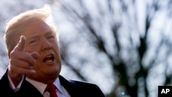 President Donald Trump speaks to reporters before boarding Marine One on the South Lawn of the White House in Washington, March 13, 2018, to travel to Andrews Air Force Base, Maryland. Trump fired Secretary of State Rex Tillerson on Tuesday and said he wo
