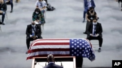 The Rev. Darryl Caldwell speaks as the casket of the late Rep. John Lewis, D-Ga., lies in repose during a service celebrating "The Boy from Troy" at Troy University, July 25, 2020, in Troy, Ala. Lewis died July 17, 2020.