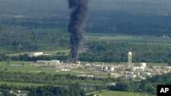 Smoke rises from a chemical plant in Crosby, near Houston, Texas, Sept. 1, 2017. Thick black smoke and towering orange flames shot up Friday from the flooded Houston-area chemical plant after two trailers of highly unstable compounds blew up a day earlier