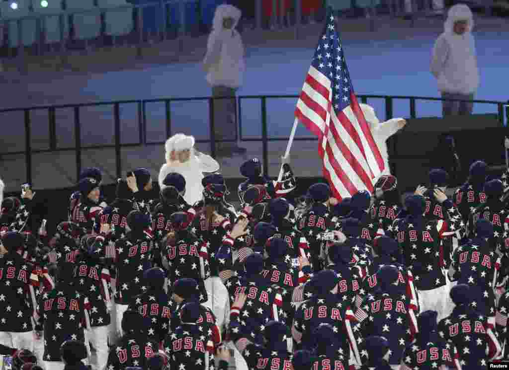 Flag-bearer Todd Lodwick of the U.S. leads his country's contingent during the opening ceremony of the 2014 Sochi Winter Olympics, Feb. 7, 2014.