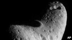 This image of another near-Earth asteroid 433 Eros reveals that its ancient surface has been scarred by numerous collisions with other small objects